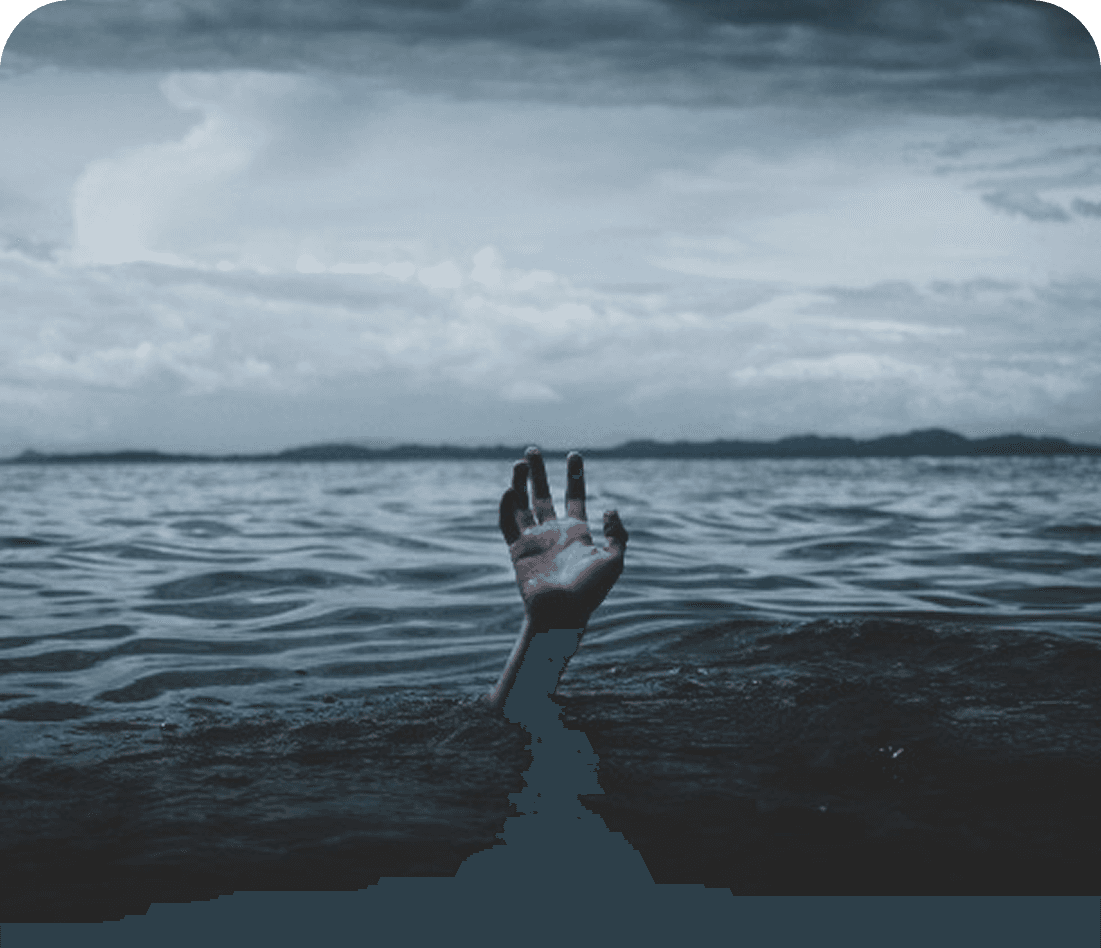Hand reaching upward from water
